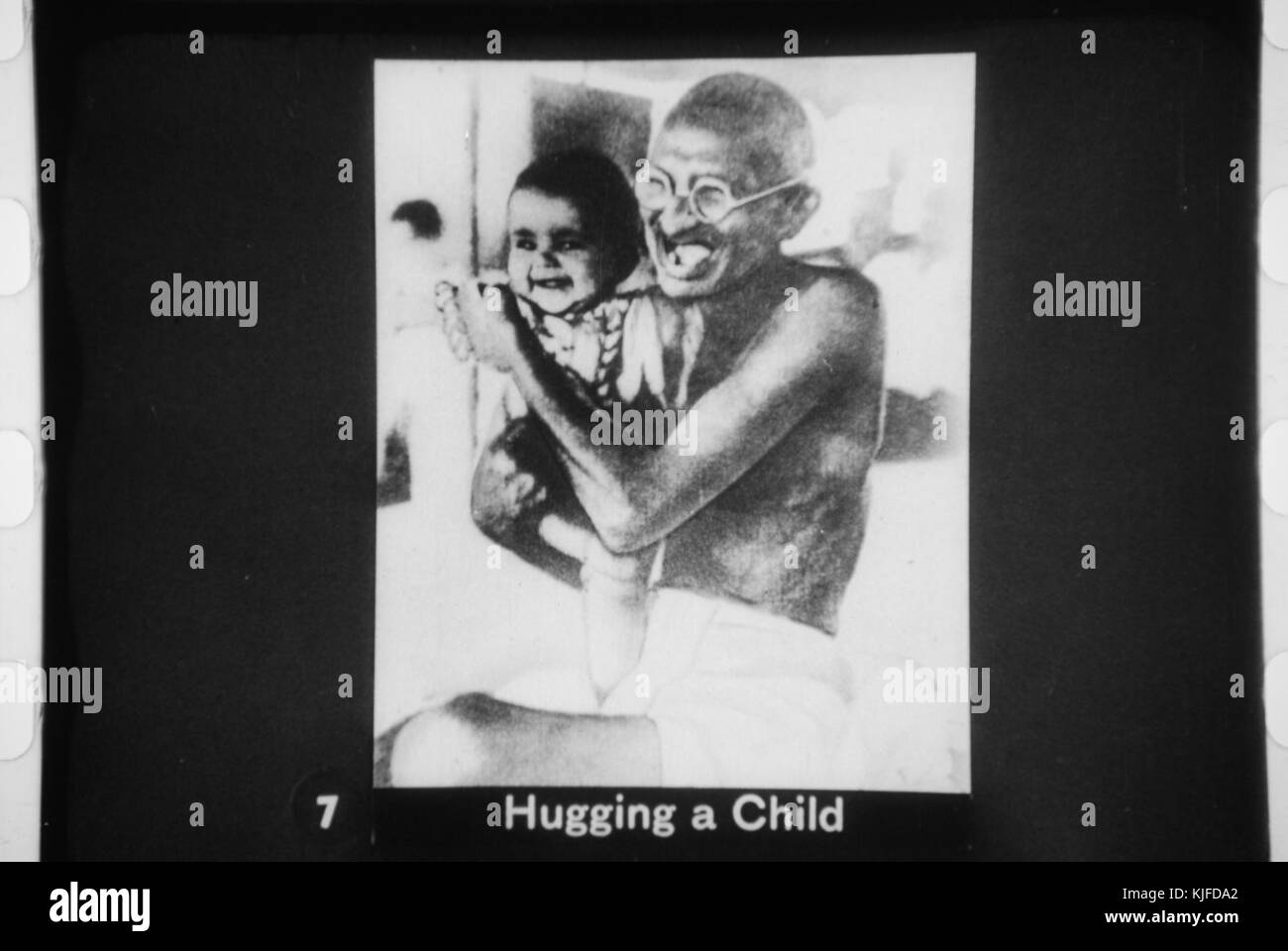 Gandhi hugging a child Stock Photo