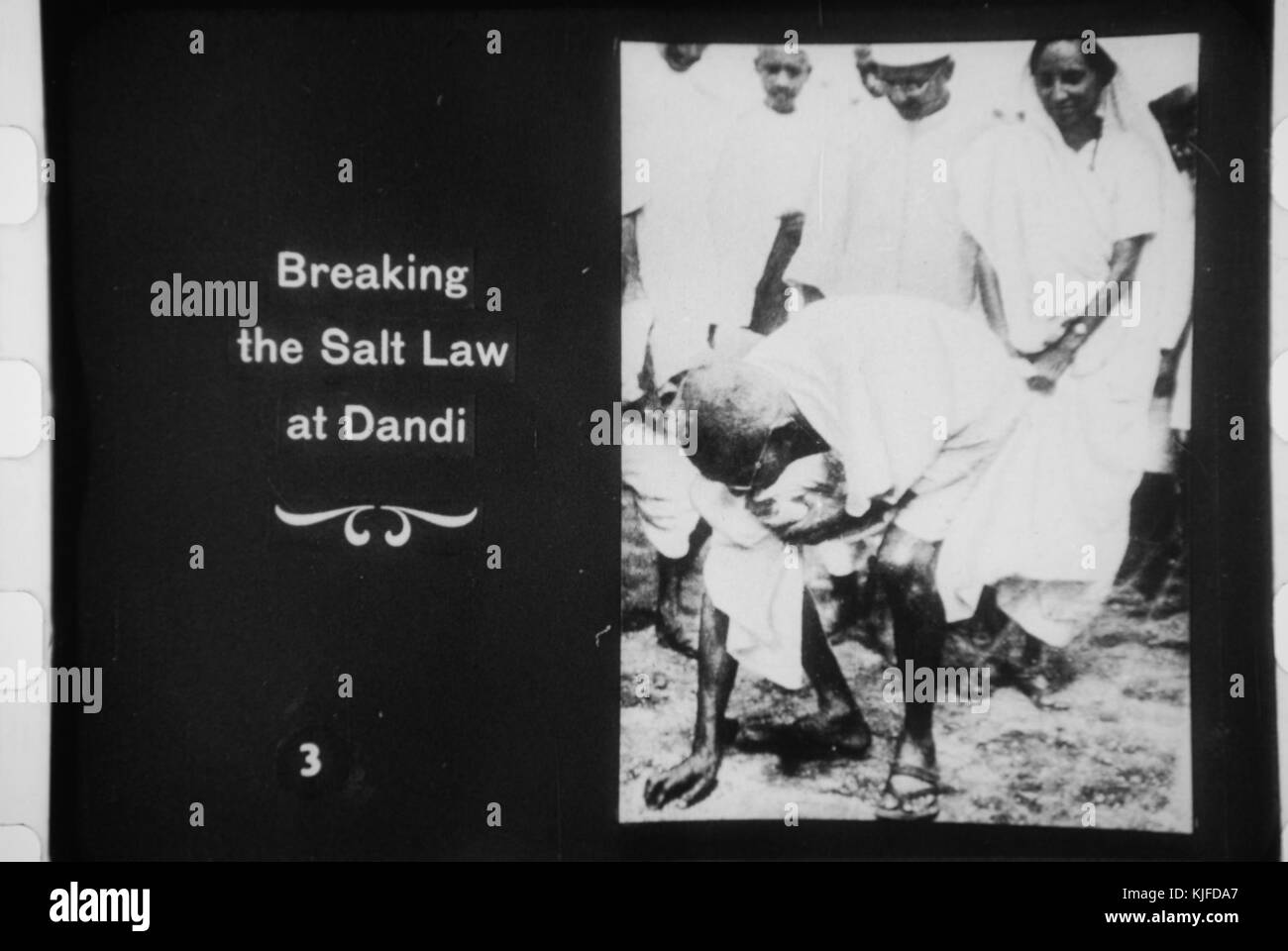 Gandhi picking up salt at Dandi Stock Photo - Alamy