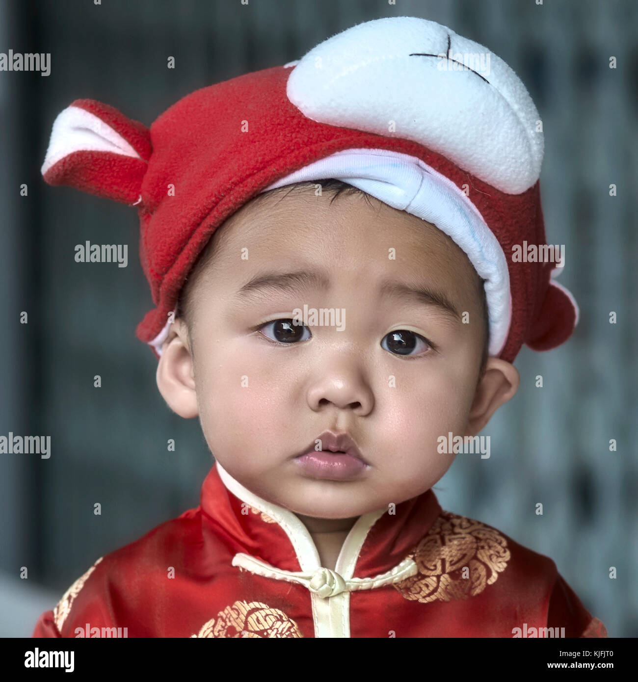 Thailand child portrait in traditional costume for Chinese New Year