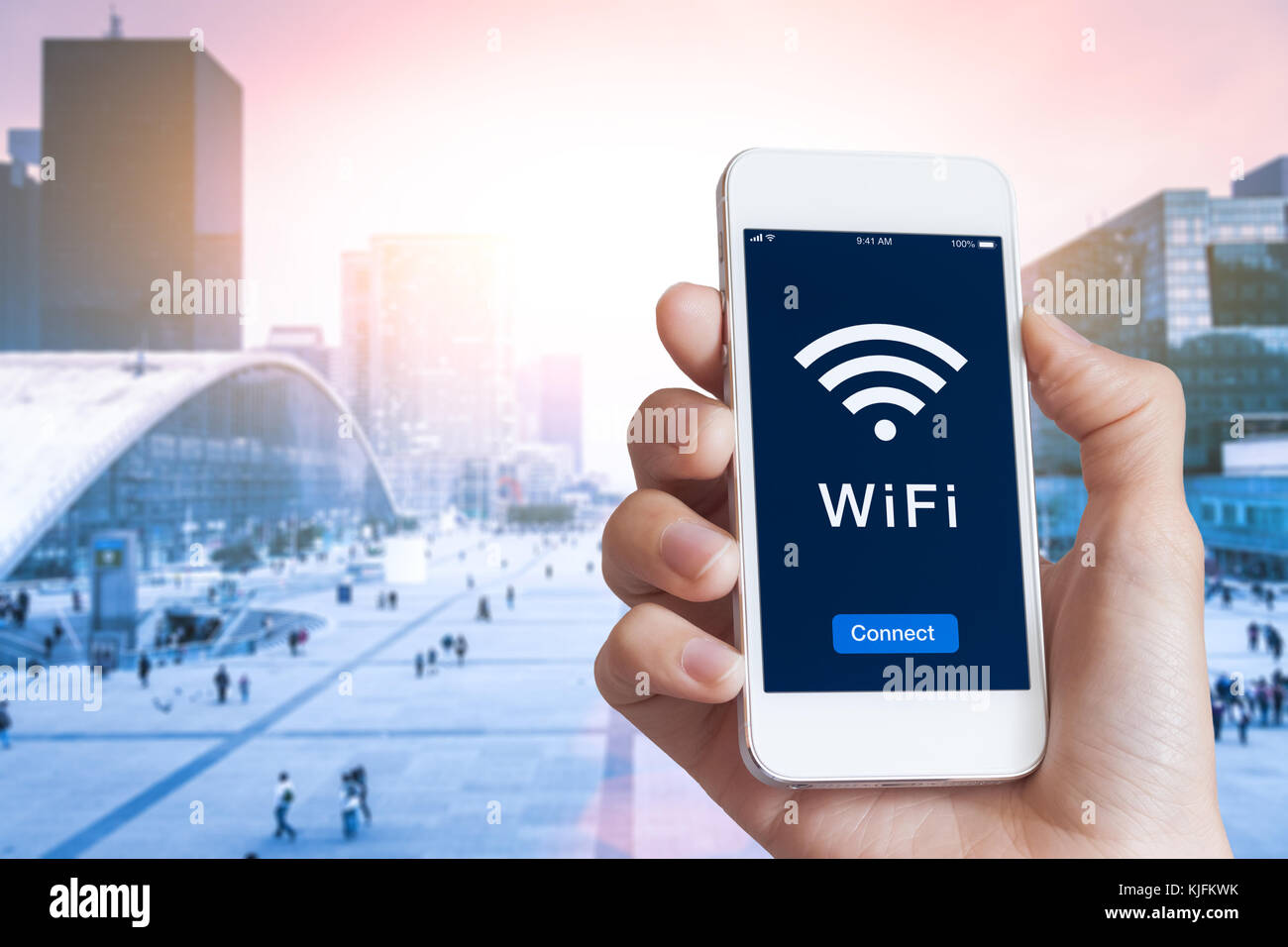 Business person connecting to WiFi hotspot on smartphone screen in  financial district to access wireless internet with blurred cityscape in  background Stock Photo - Alamy