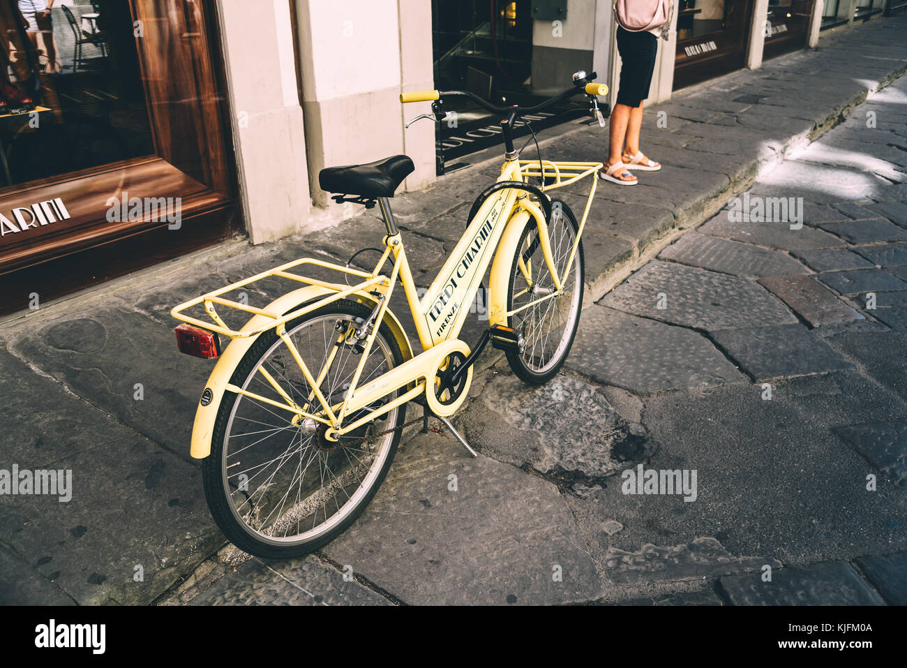 Bicycle Parked By Store In City Stock Photo