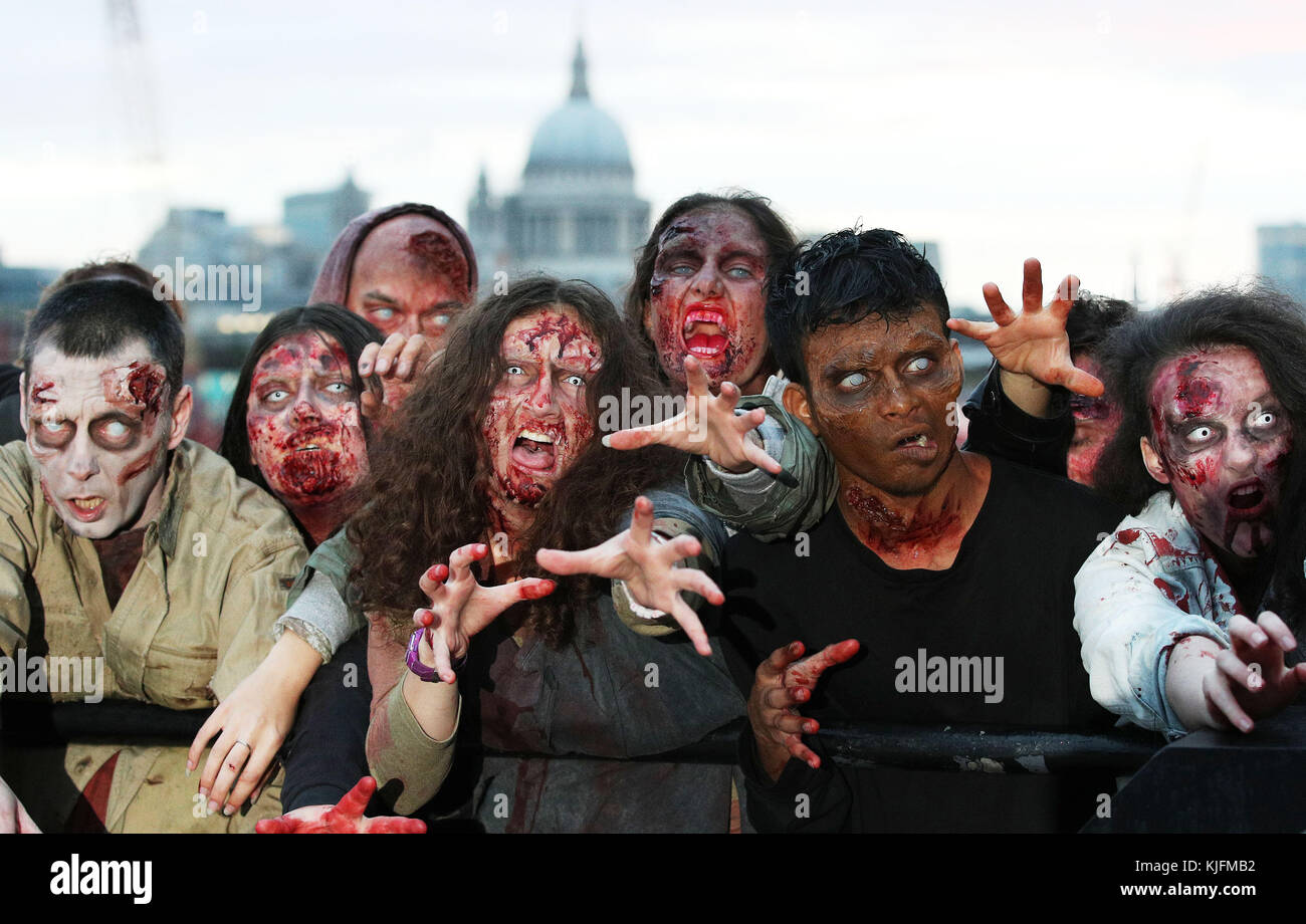 The Walking Dead descend on ‘Walkerloo’ - 100 ‘Walkers’ in gory prosthetics marked the 100th episode of the hit TV show The Walking Dead, which premieres on Fox tonight at 9pm. After eight hours in make-up, the 100 fanatics walked from the Southbank and over Waterloo Bridge before converging on the London underground, shocking commuters in their path.  Where: London, United Kingdom When: 23 Oct 2017 Credit: Joe Pepler/PinPep/WENN.com Stock Photo