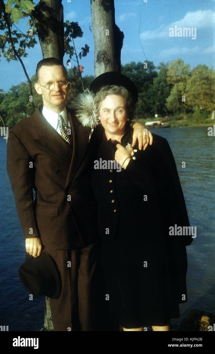 Vernacular snapshot image of couple with lake, 1945. Stock Photo
