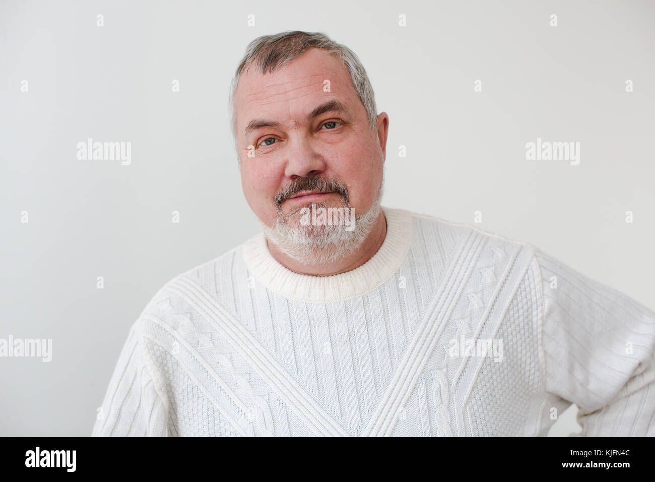 Middle aged bearded man looking at camera smiling Stock Photo