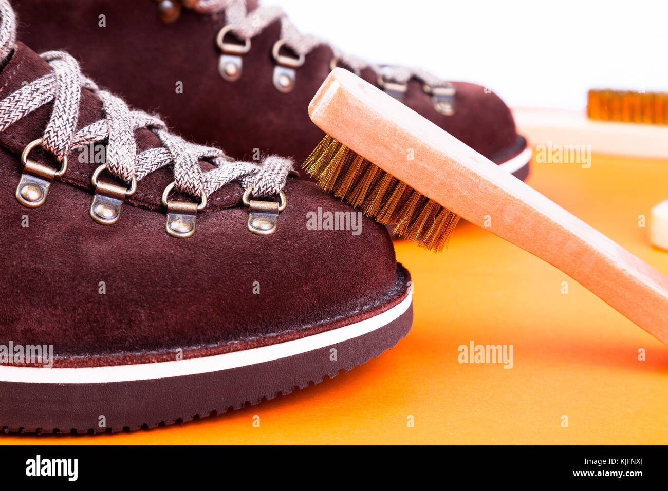 Brown man suede boots with brush. Macro. Clean shoes Stock Photo Alamy