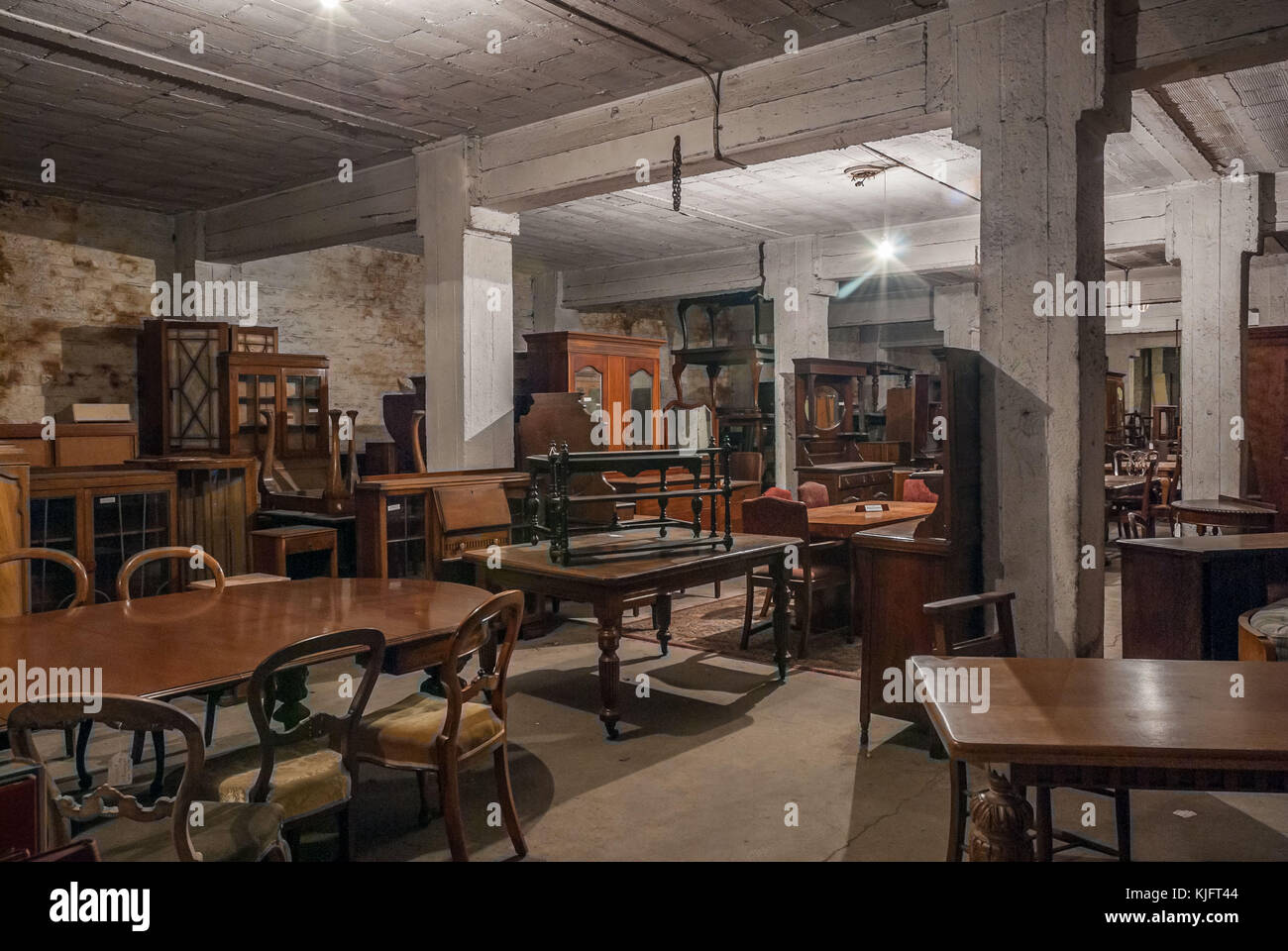 An old warehouse full of antique furnture. Stock Photo