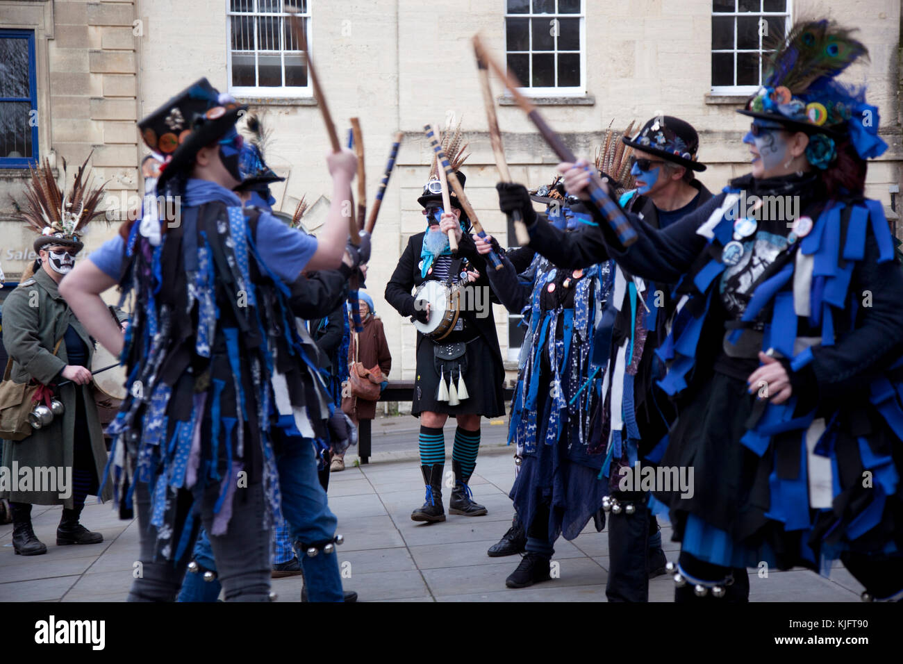 Morris dancers with blue face disguises entertain during the Stroud wassail outside the Cotswold town hall Stock Photo