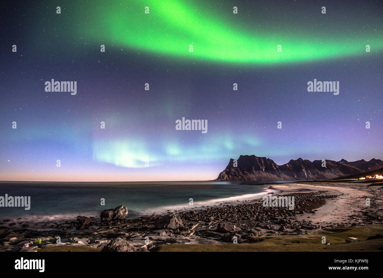 Flickering northern lights above Utakleiv beach Stock Photo