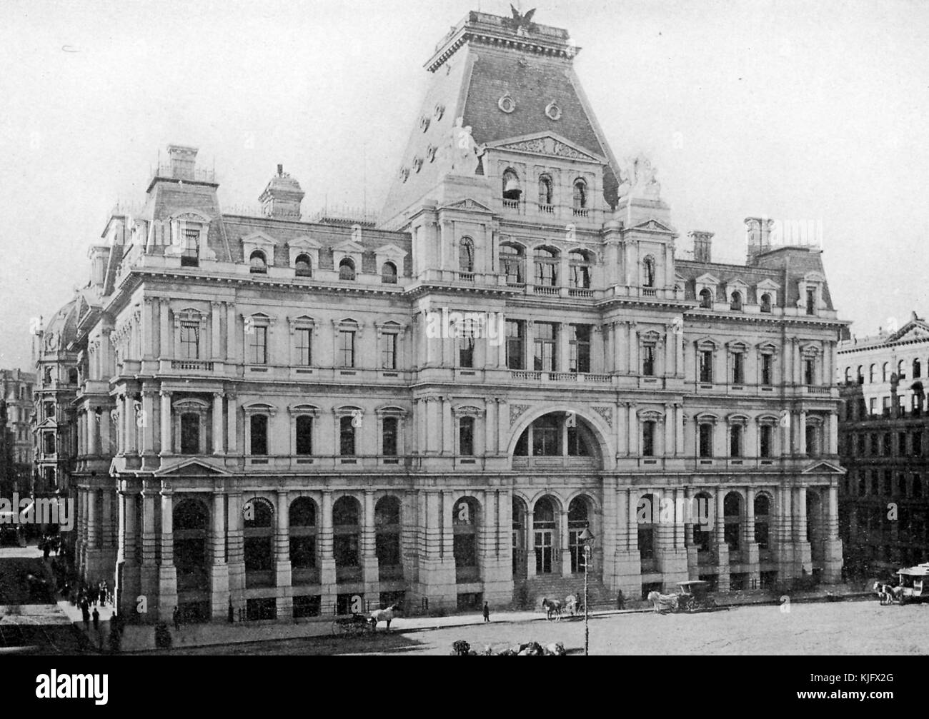 An exterior photograph of the old Post Office building, it was located in Post Office Square, the building was completed in 1874 even though most of the surrounding buildings were destroyed in the Great Fire of 1872, the building was demolished in 1933 and the John W McCormack Post Office and Courthouse were built on the site, Boston, Massachusetts, 1905. Stock Photo