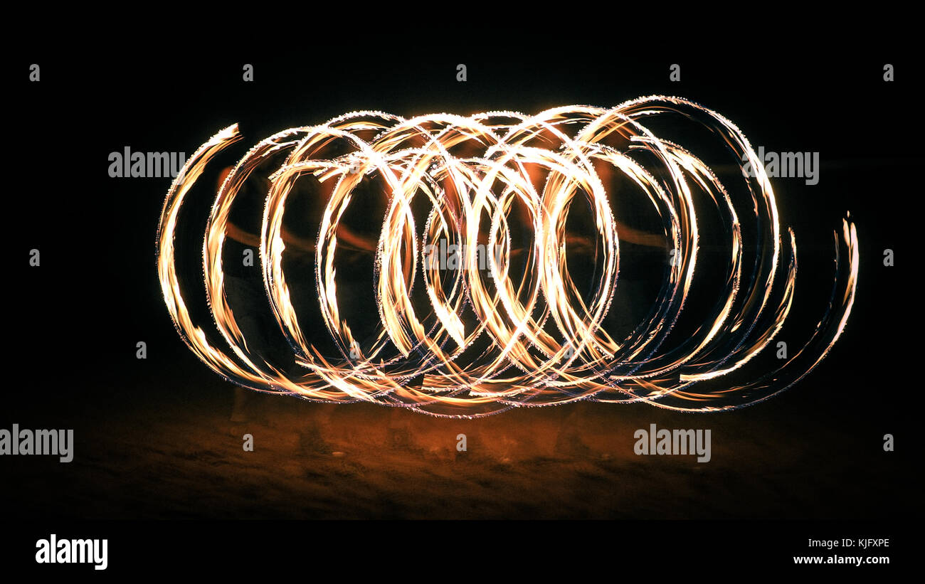 Spinning Fire Poi Rings of Fire Stock Photo