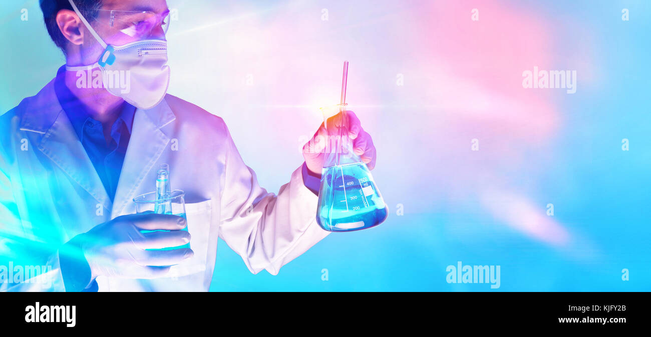 Worker equipped with protective elements and laboratory chemical material with blue red lights background. Horizontal composition. Stock Photo