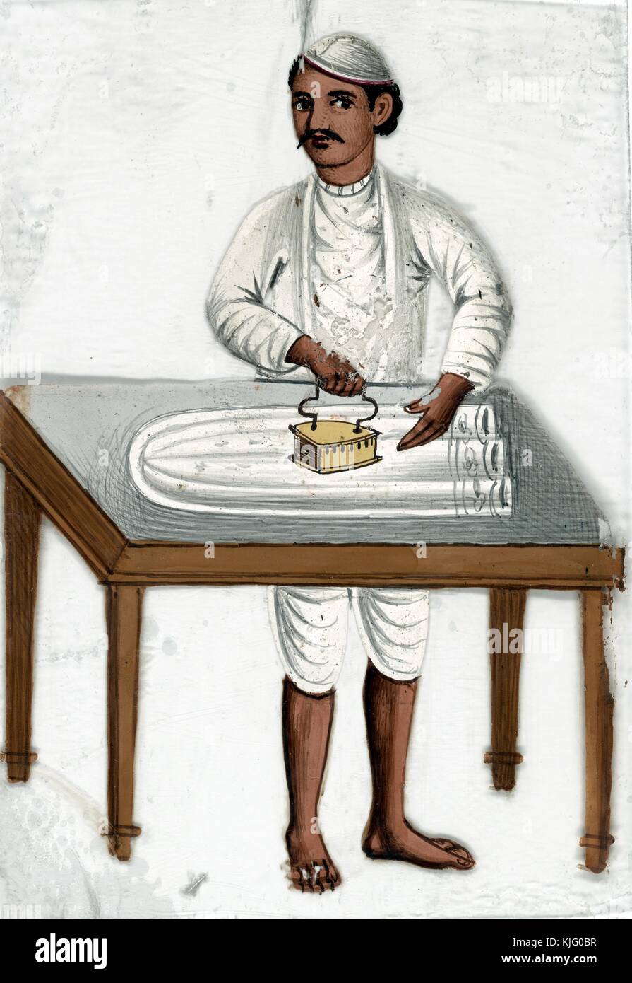 Male servant ironing on table, India, 1819. From the New York Public Library. Stock Photo