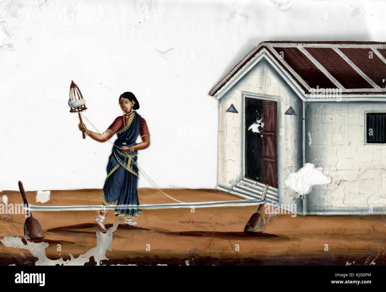 Female spinner in front of white building, India, 1819. From the New York Public Library. Stock Photo