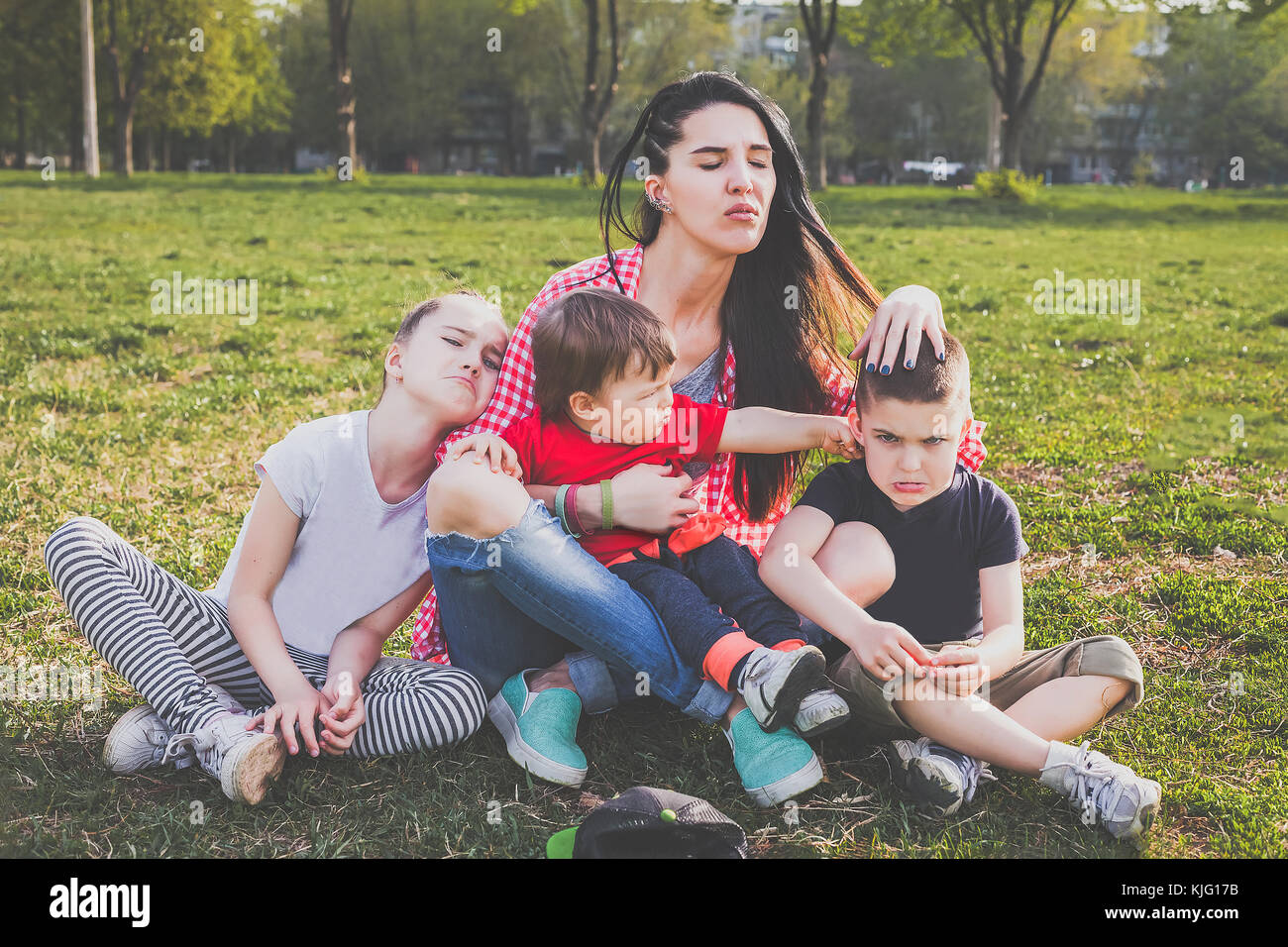 Happy family playing in the park Stock Photo - Alamy