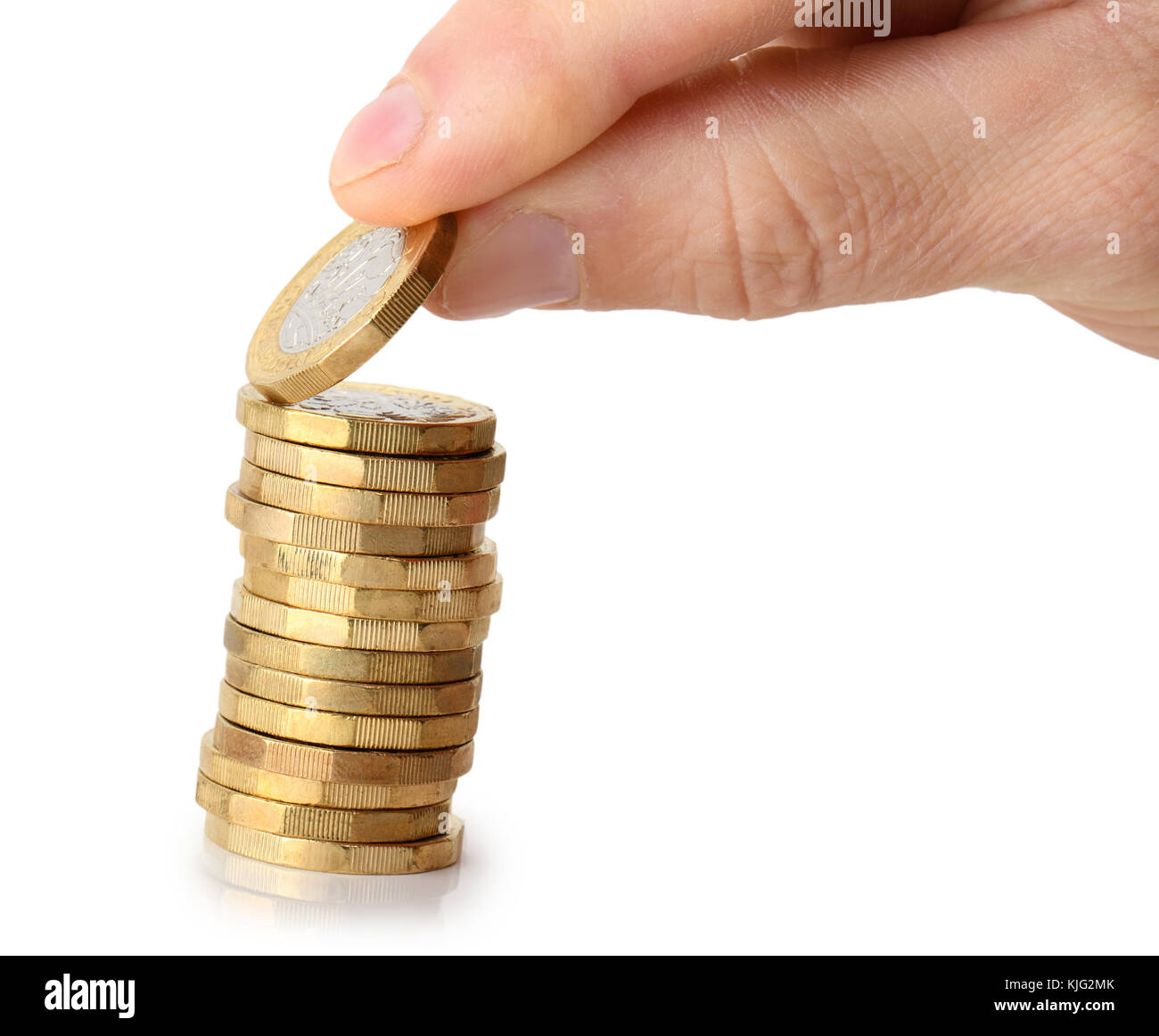 taking a coin from the stack, isolated on a white background Stock Photo