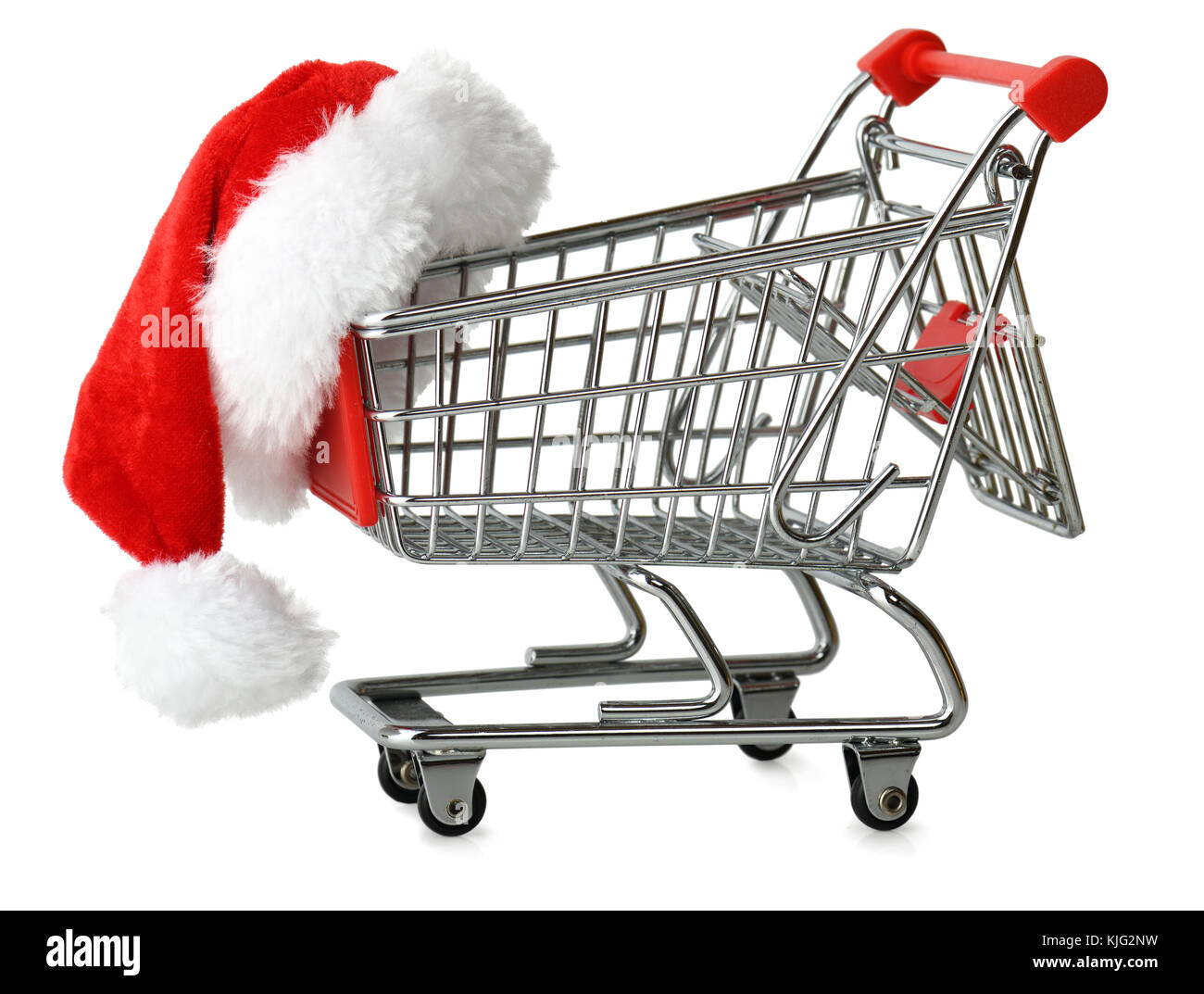 Concept of christmas shopping with santa hat on a shopping cart isolated on a white background Stock Photo