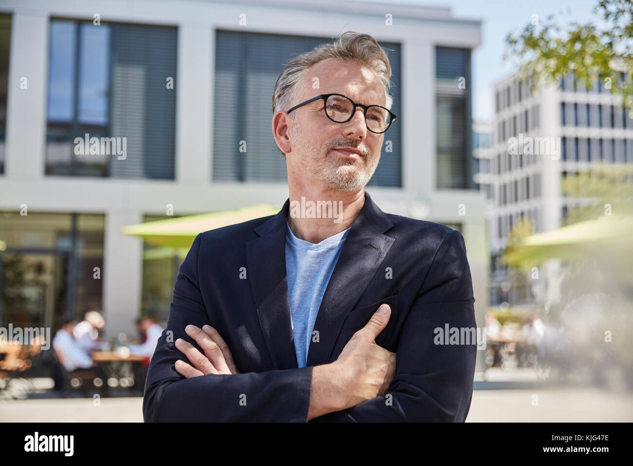 Portrait of businessman with arms crossed Stock Photo - Alamy