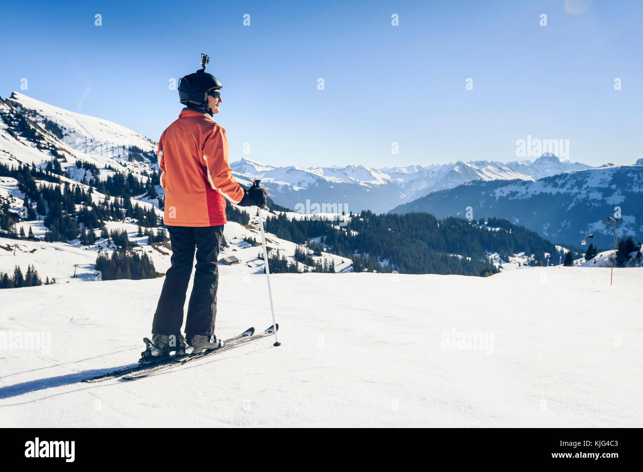 Austria, Damuels, skier with action cam in winter landscape Stock Photo