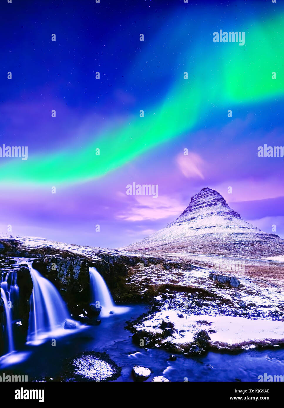 View of the northern light over Kirkjufell Mountain in Iceland. Stock Photo