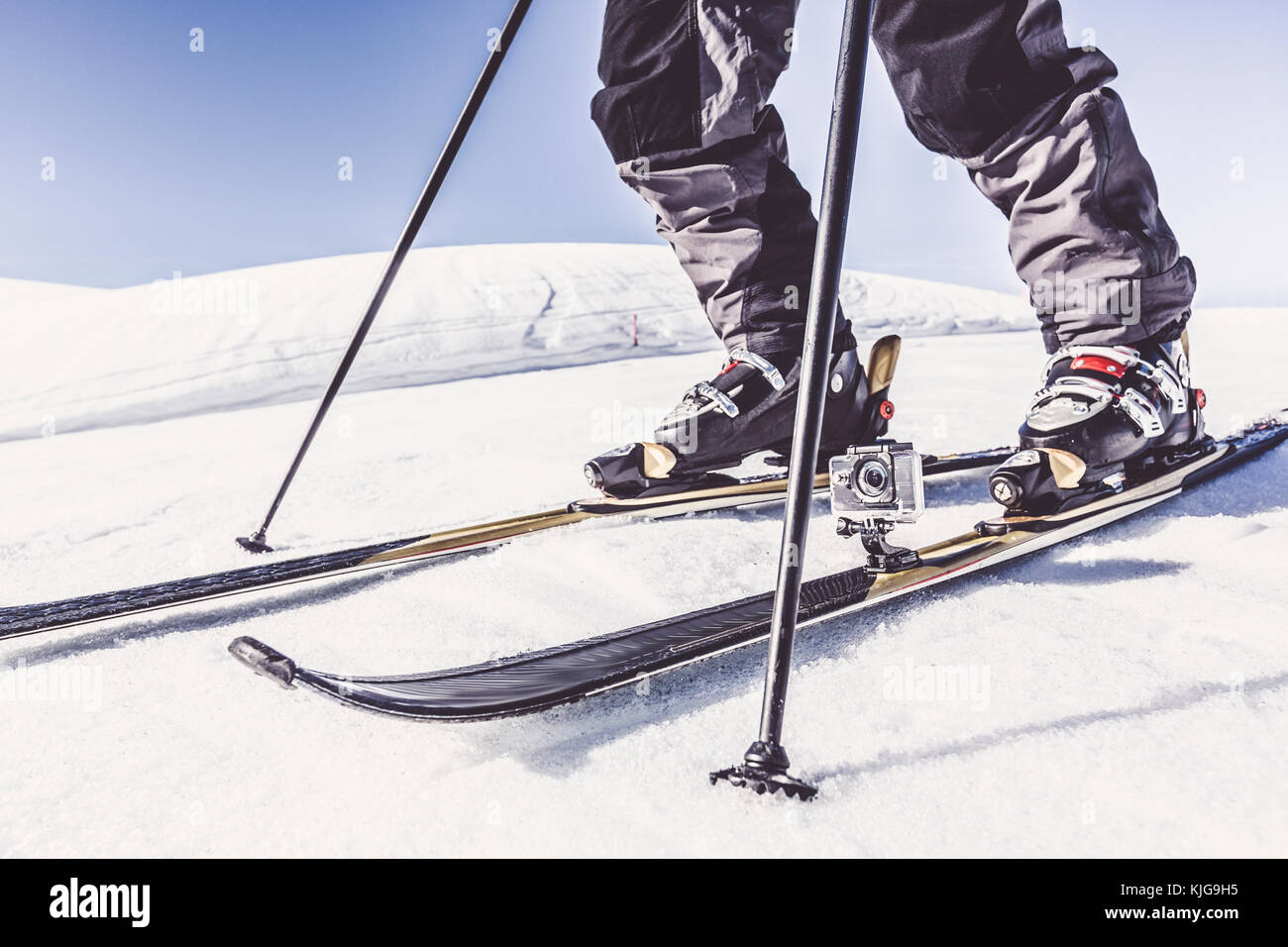 Close-up of skier with action cam in winter landscape Stock Photo