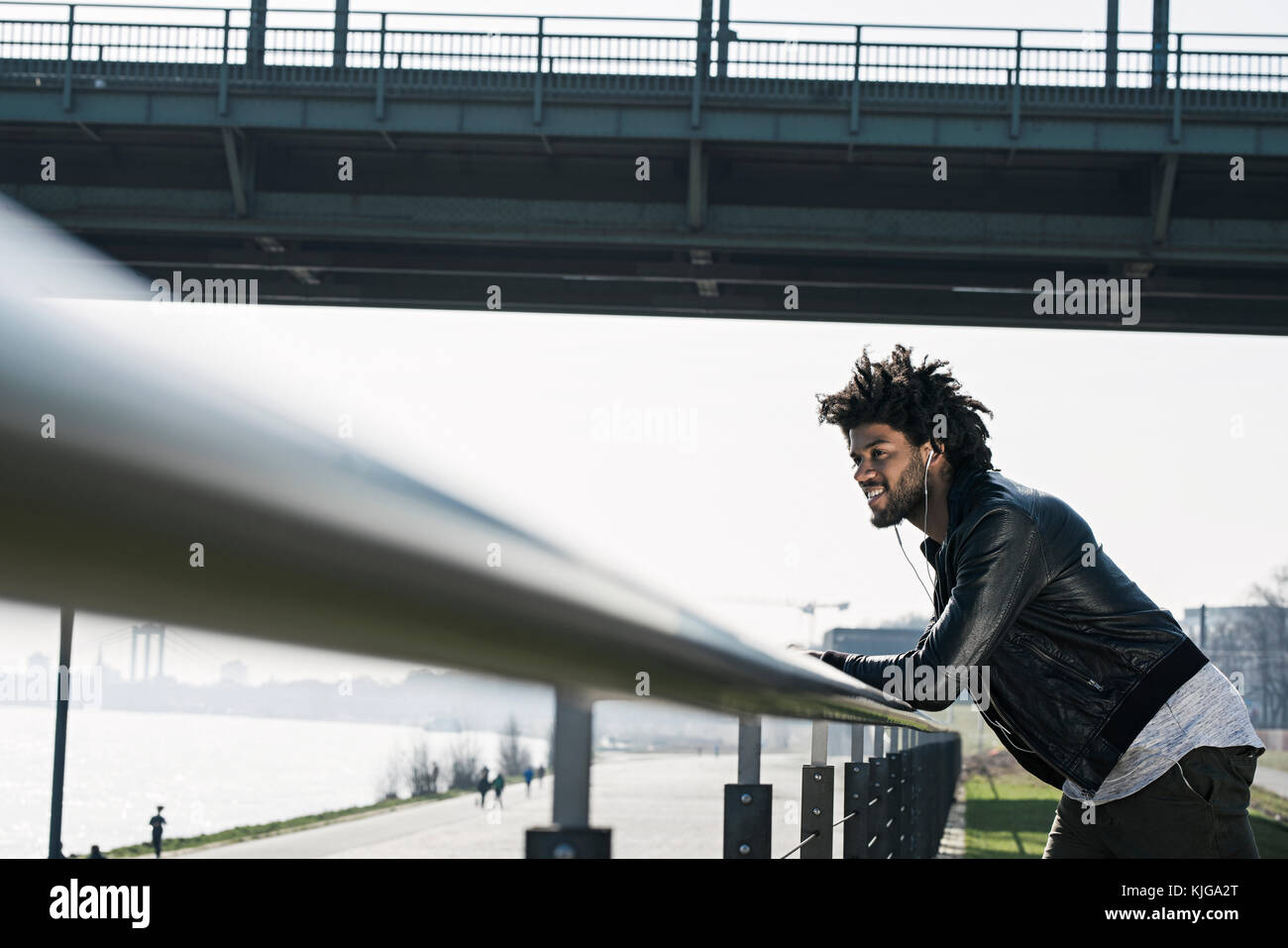 Leaning over rail hi-res stock photography and images - Alamy