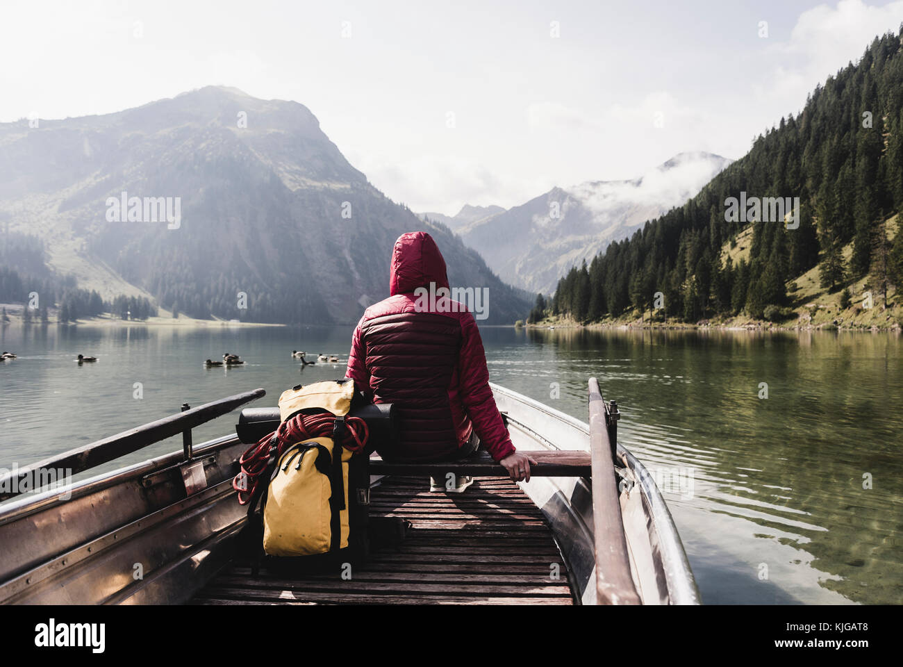 Austria, Tyrol, Alps, woman in boat on mountain lake Stock Photo