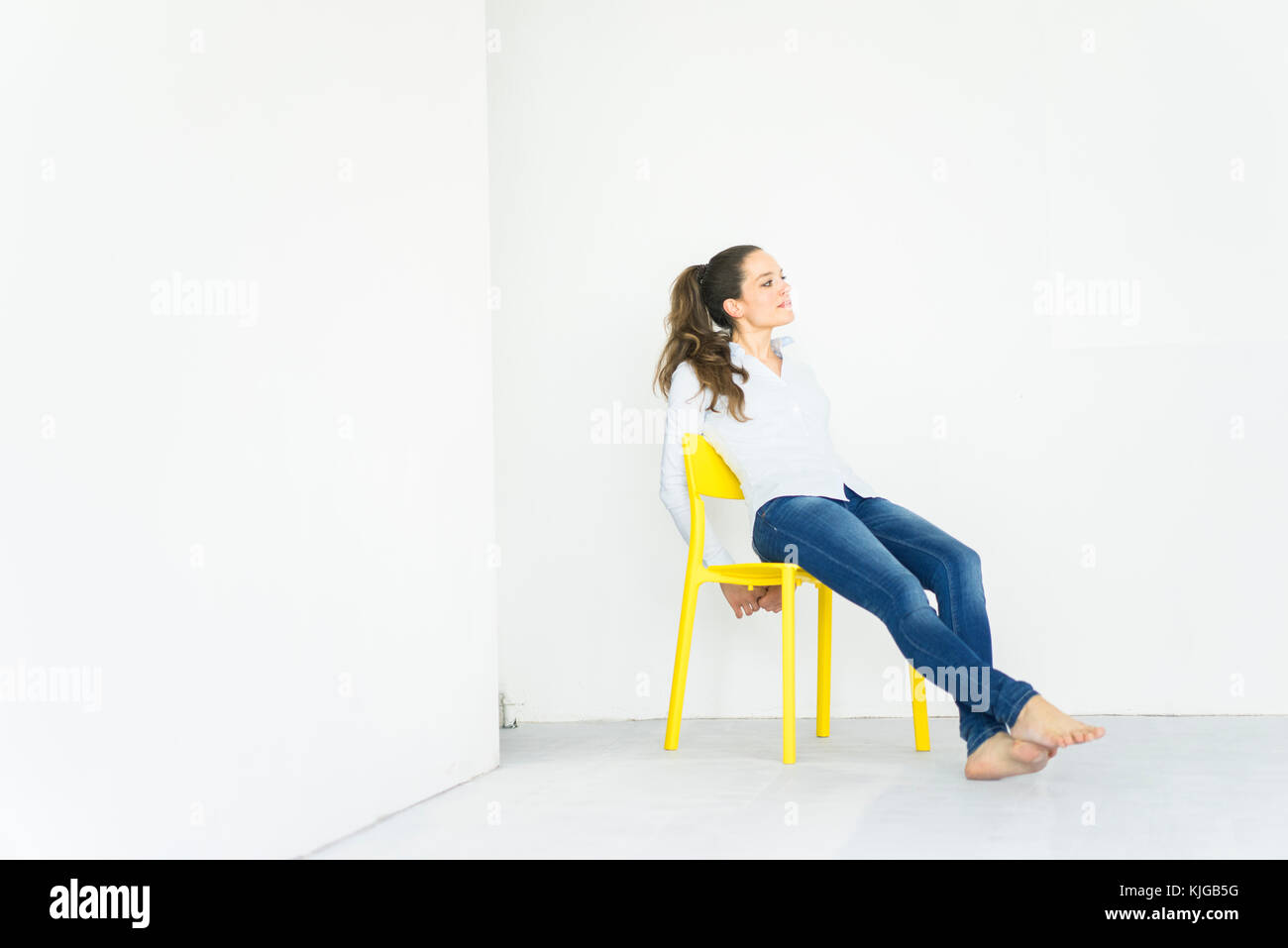 Woman sitting chair full length hi-res stock photography and images - Alamy