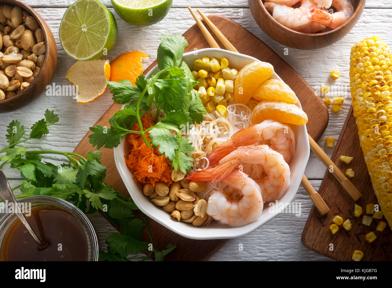 A delicious shrimp noodle bowl with rice noodle, mandarin orange