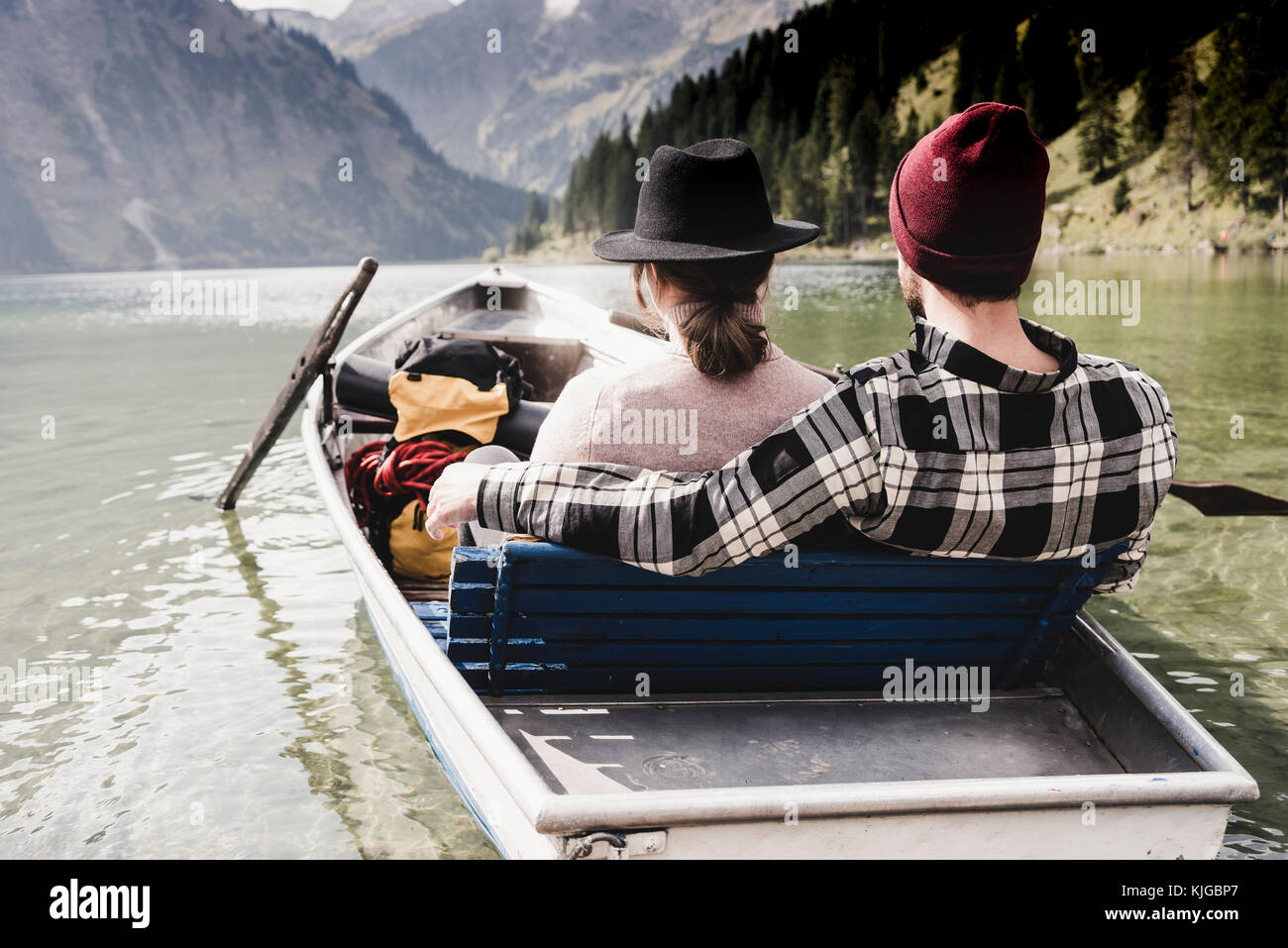 Austria, Tyrol, Alps, relaxed couple in rowing boat on mountain lake Stock Photo
