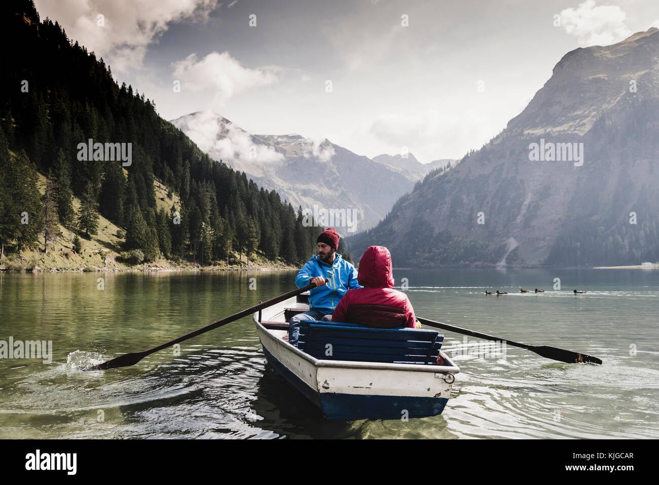 Austria, Tyrol, Alps, couple in rowing boat on mountain lake Stock Photo