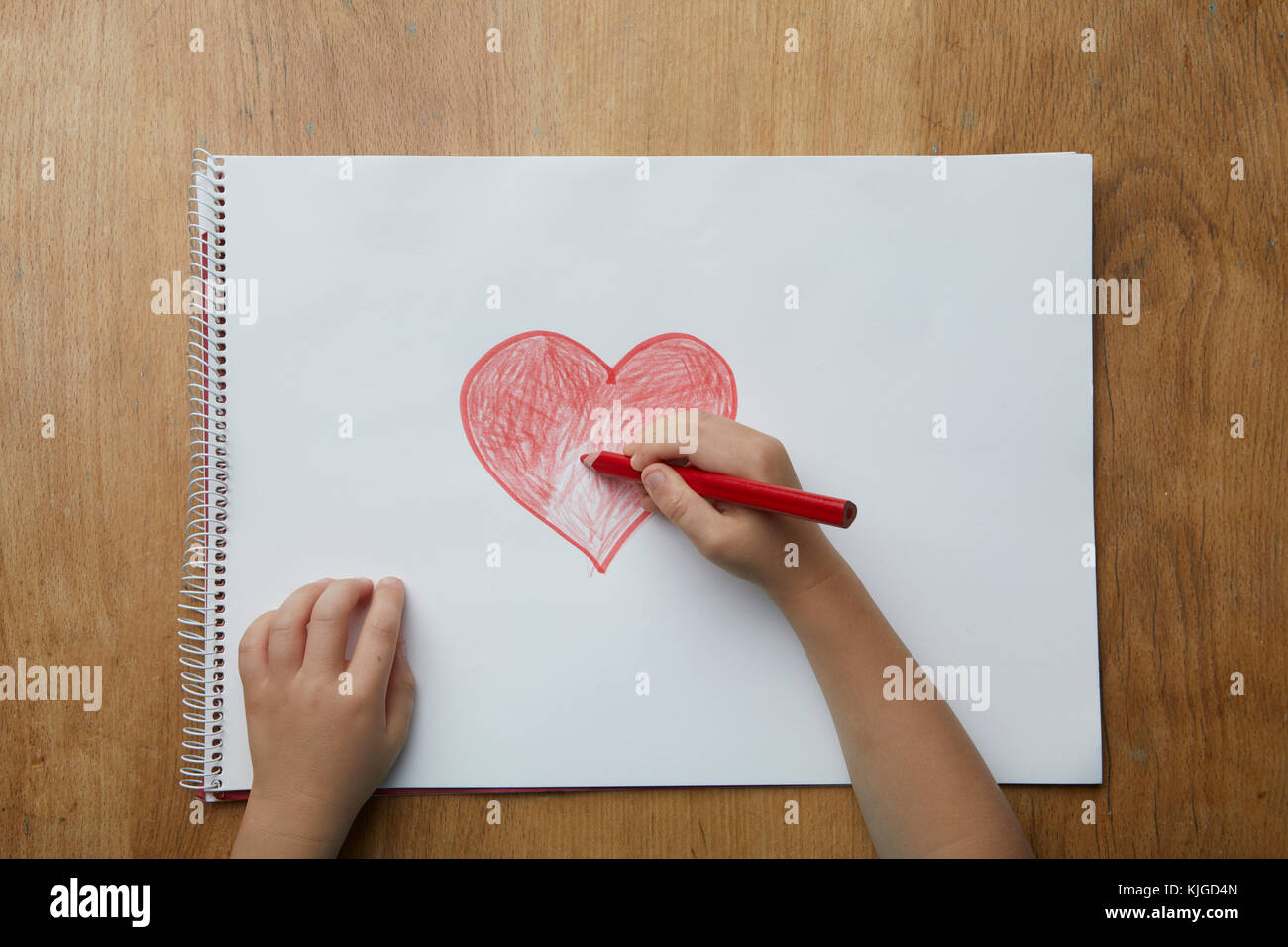 Child drawing heart Stock Photo