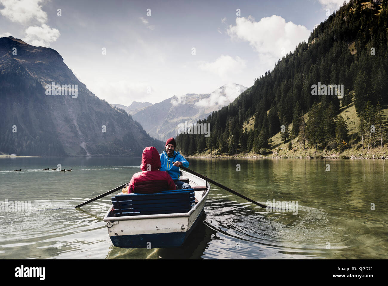Austria, Tyrol, Alps, couple in rowing boat on mountain lake Stock Photo
