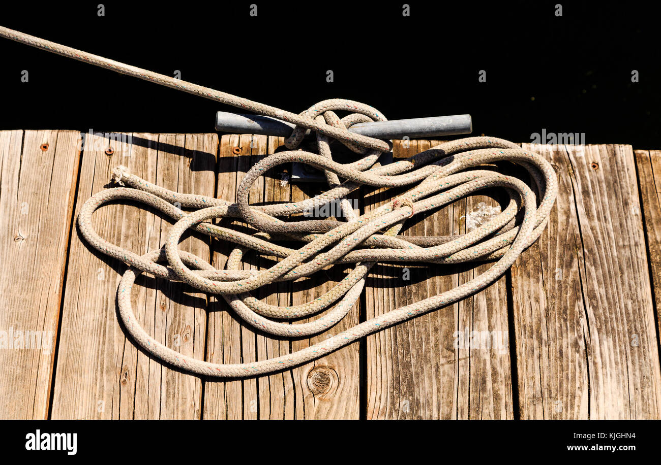 Rope on Cleat to Black Background Stock Photo Alamy