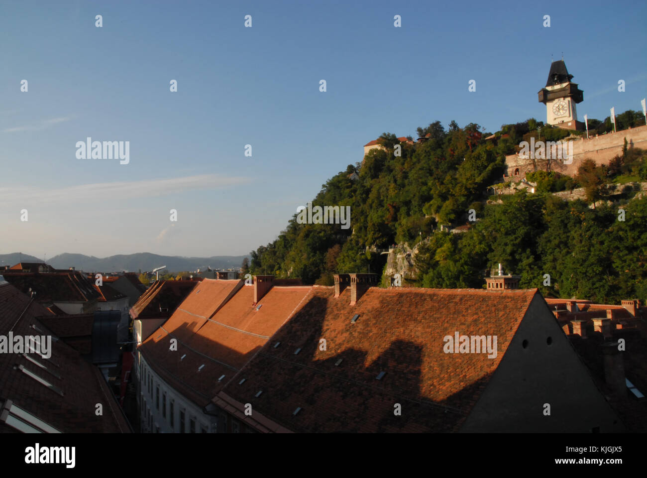 Schlossberg and Uhrturm in Graz, Austria, during sunset seen from the ...