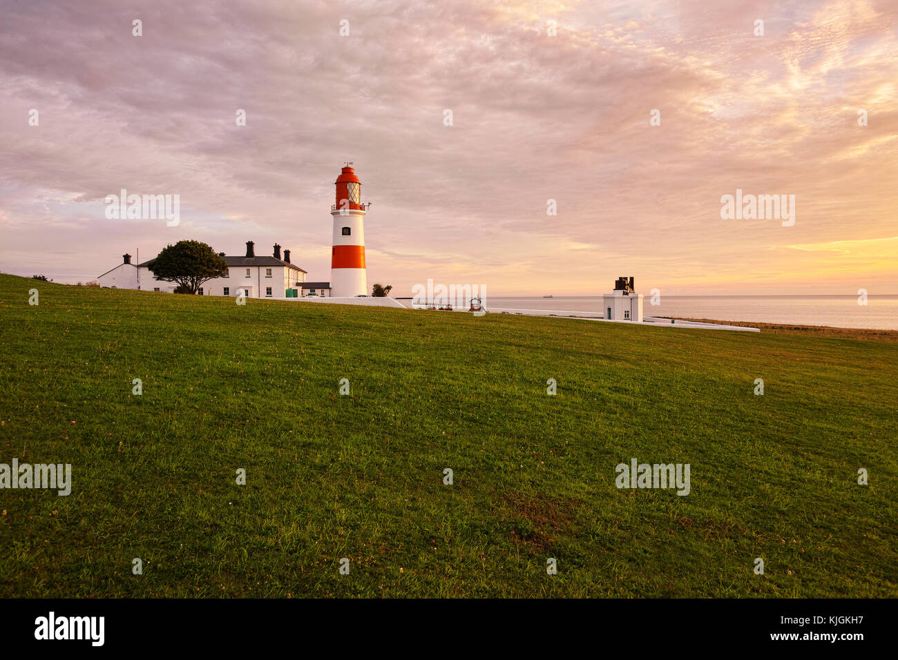 Souter Lighthouse is a lighthouse located in the village of Marsden in South Shields, Tyne & Wear, England. On a summers morning at sunrise.July Stock Photo