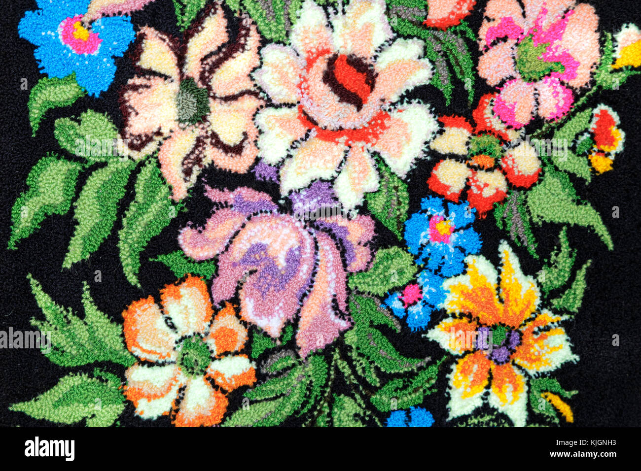 Crafts Beautiful Red Blue And Yellow Flower Embroidered On A Black Background Stock Photo Alamy Crafts Beautiful Red Blue And Yellow Flower Embroidered On A Black Background Stock Photo Alamy