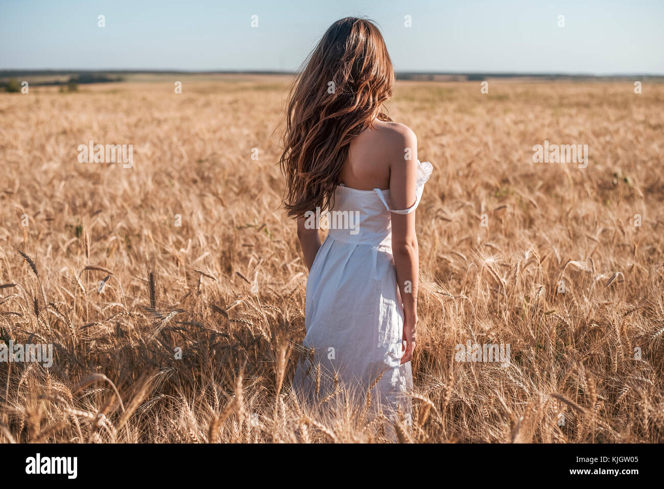 Girl in a white dress field, wheat outdoor recreation, beautiful dress