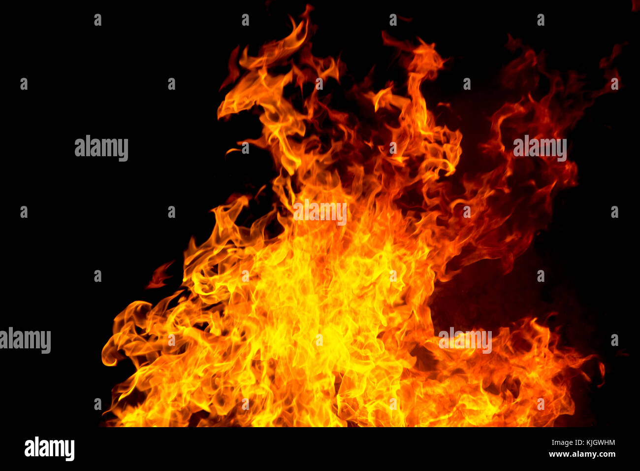 Photo of red fire flame on black background Stock Photo - Alamy
