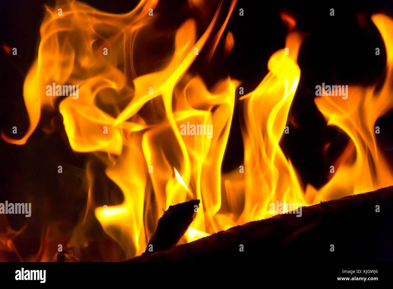 Photo of red fire flame on black background Stock Photo - Alamy
