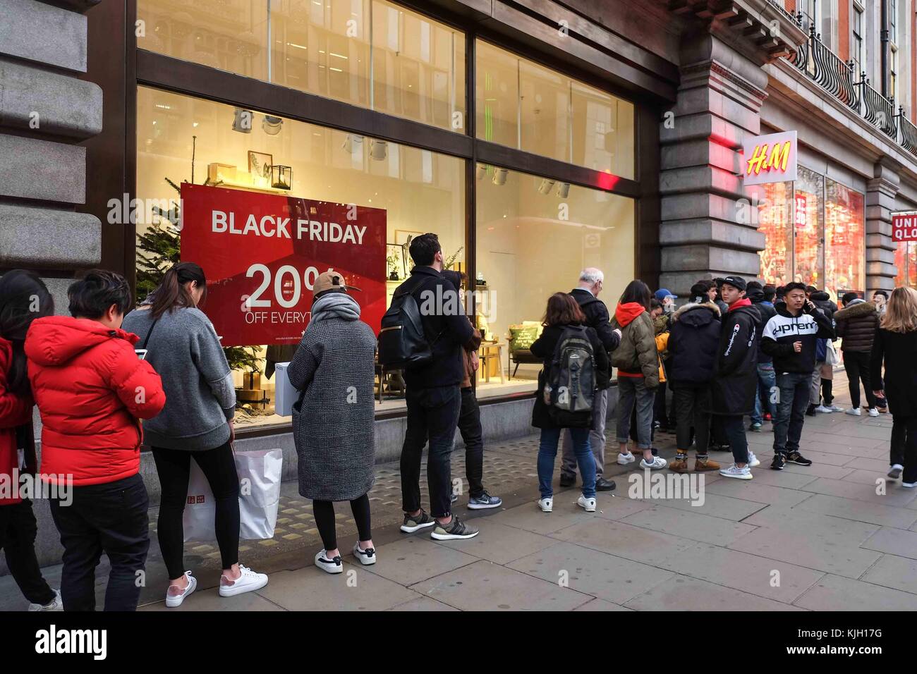 London, UK. 24th Nov, 2017. Eager black friday shoppers queue outside Uniqlo  and H&M on Oxford Street before the stores opens at 8am. : Credit: claire  doherty/Alamy Live News Stock Photo - Alamy
