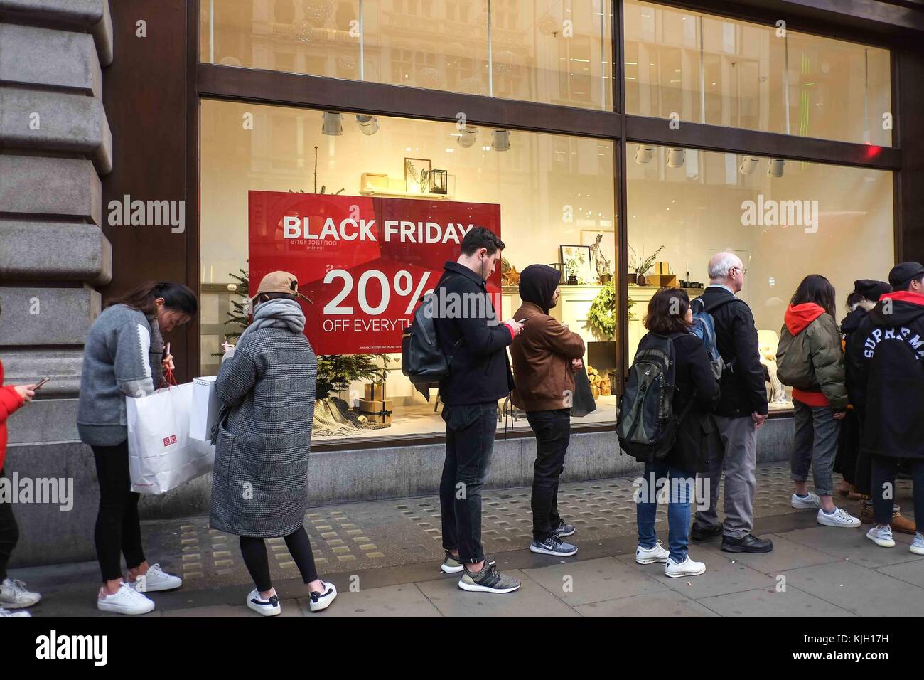 London, UK. 24th Nov, 2017. Eager black friday shoppers queue outside Uniqlo  an H&M on Oxford Street before the stores opens at 8am. : Credit: claire  doherty/Alamy Live News Stock Photo - Alamy