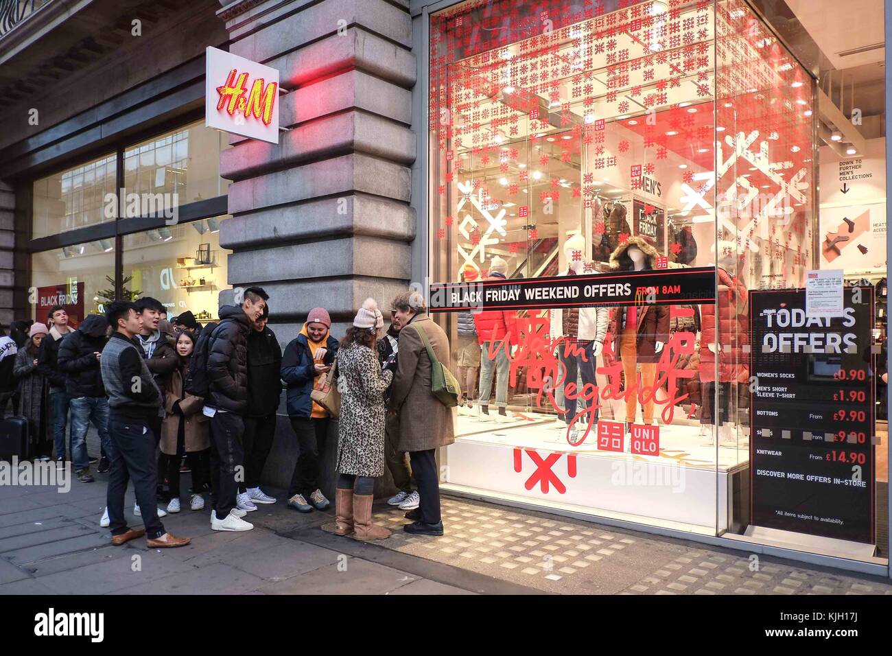 London, UK. 24th Nov, 2017. Eager black friday shoppers queue outside  Uniqlo an H&M on Oxford Street before the stores opens at 8am. : Credit:  claire doherty/Alamy Live News Stock Photo - Alamy