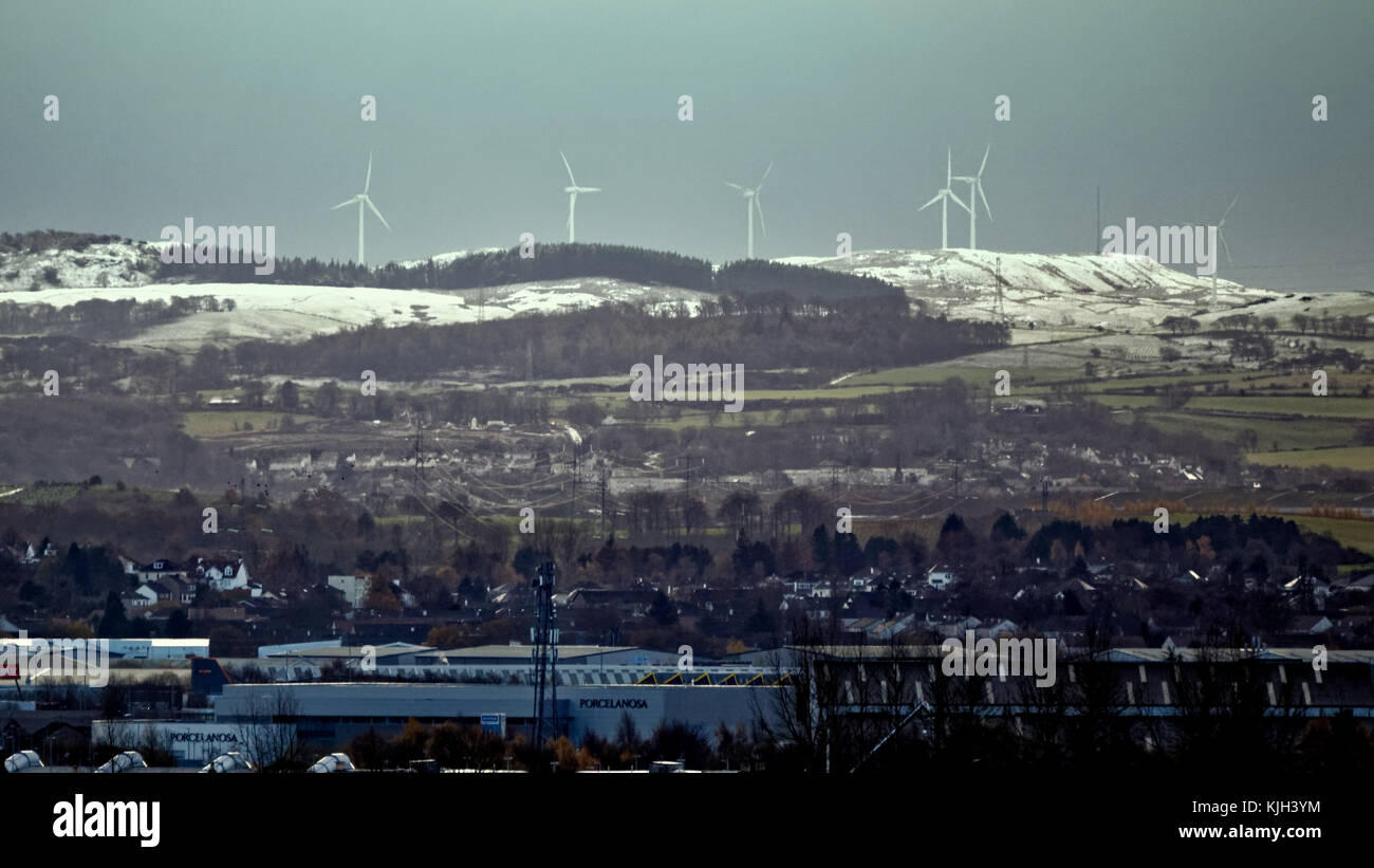 Glasgow, Scotland, UK 24th November. UK Weather: First snow to fall in the city as heavy showers hit the south of the city with Whitelee Wind Farm europe's largest windfarm snow covered over foreground braehead . Credit: gerard ferry/Alamy Live News Stock Photo