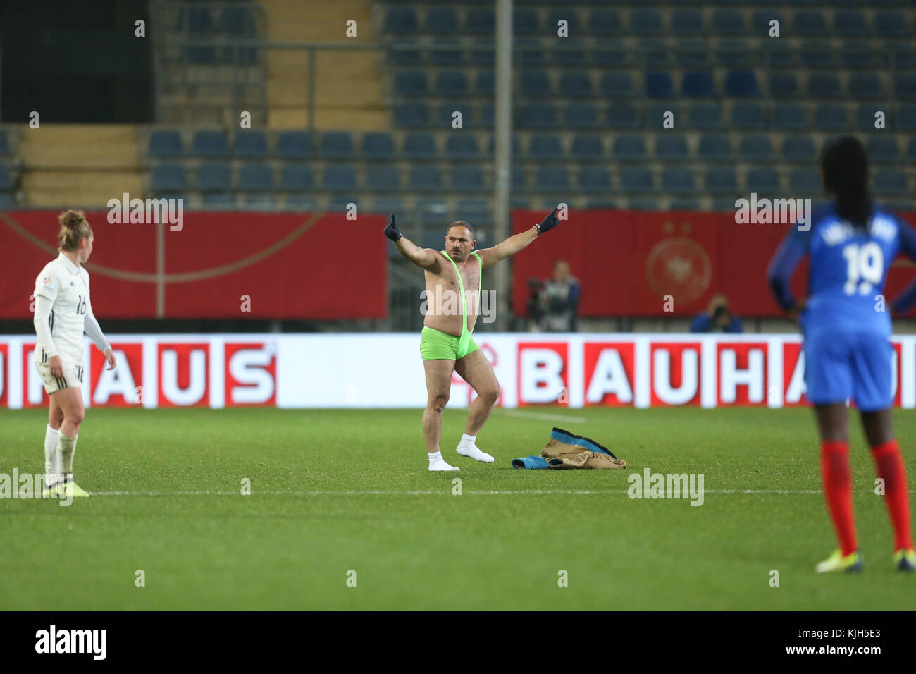 A streaker runs onto the field during the women's international friendly soccer match between Germany and France in the Schueco Arena stadium in Bielefeld, Germany, 24 November 2017. Photo: Friso Gentsch/dpa Stock Photo