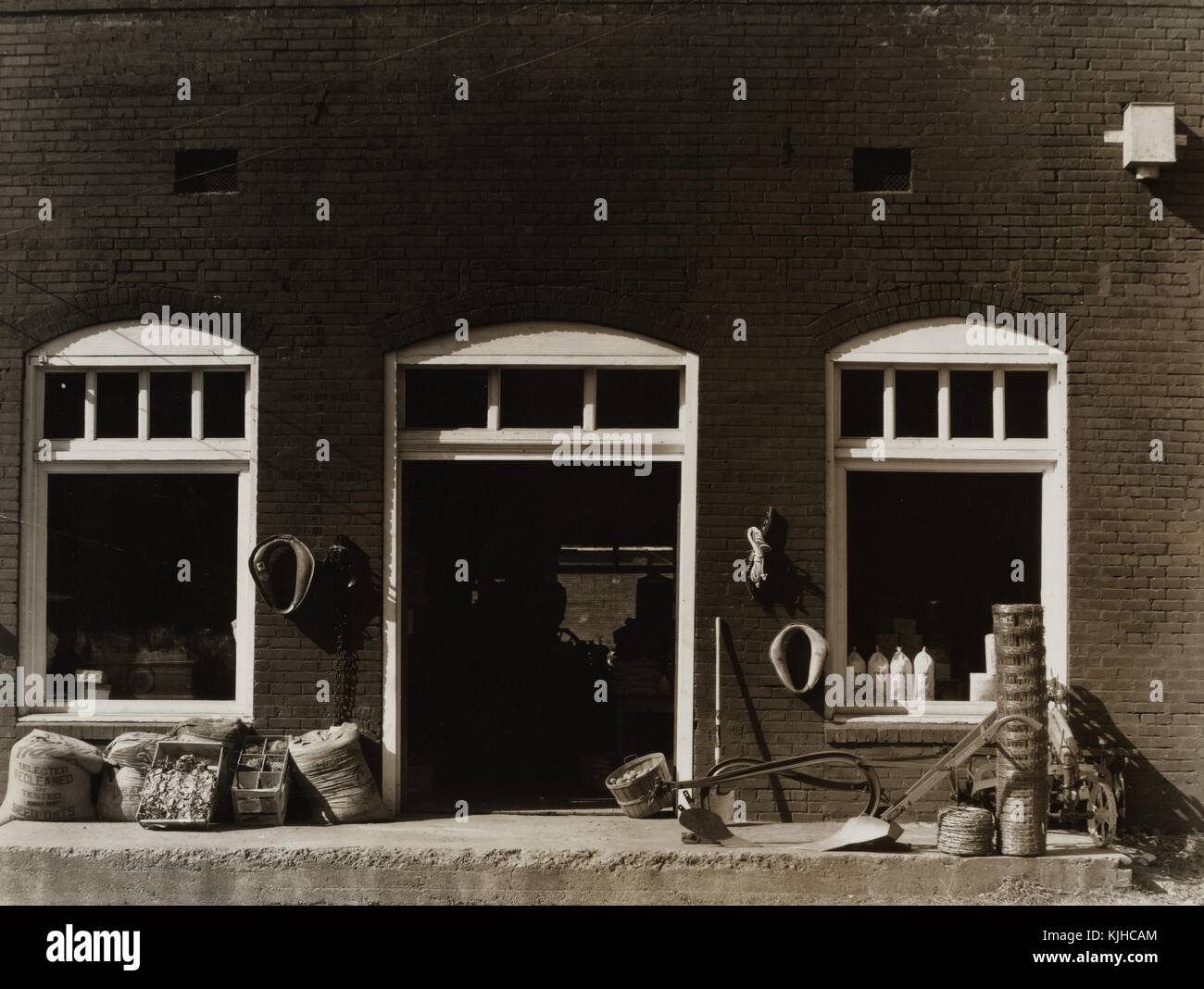 Black and white photograph of the front of a general store, by Walker Evans, American photographer known for his work for the Farm Security Administration documenting the effects of the Great Depression, Mississippi, 1936. From the New York Public Library. Stock Photo