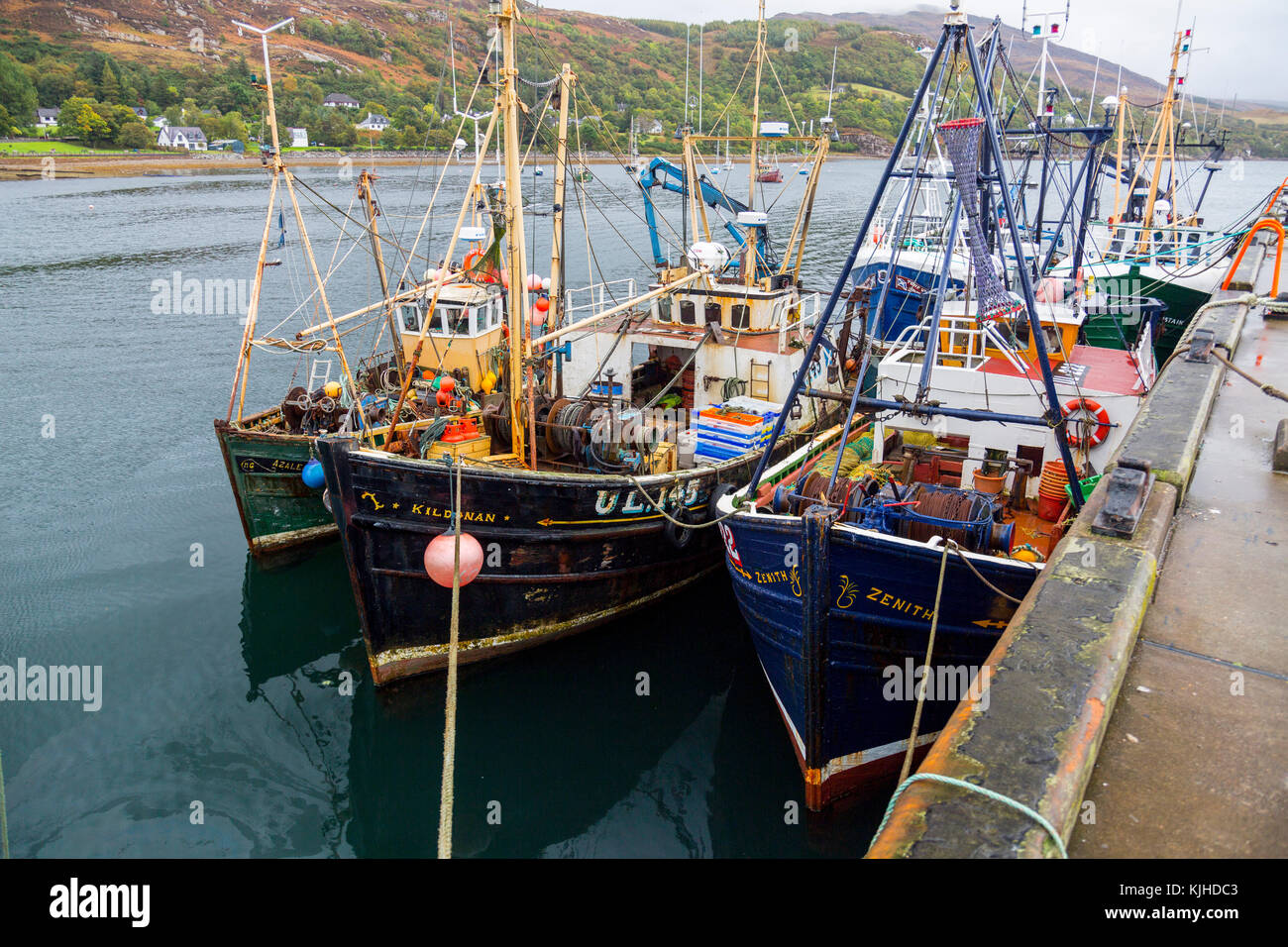 A collection of traditional fishing boats moored in Loch Broom at Ullapool, Highland, Scotland, UK Stock Photo