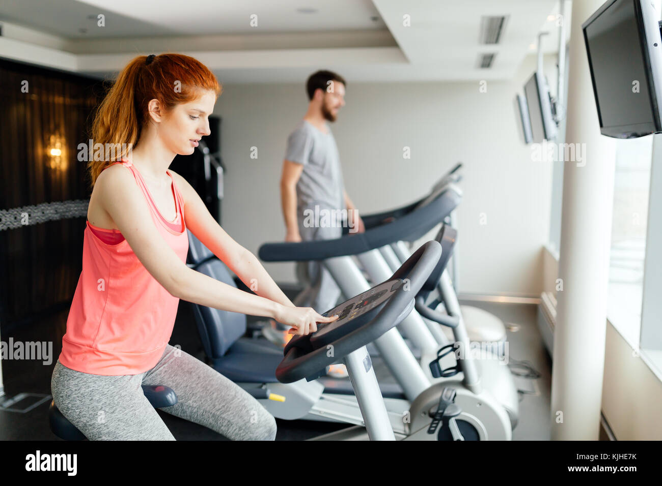 People cardio exercising in gym Stock Photo