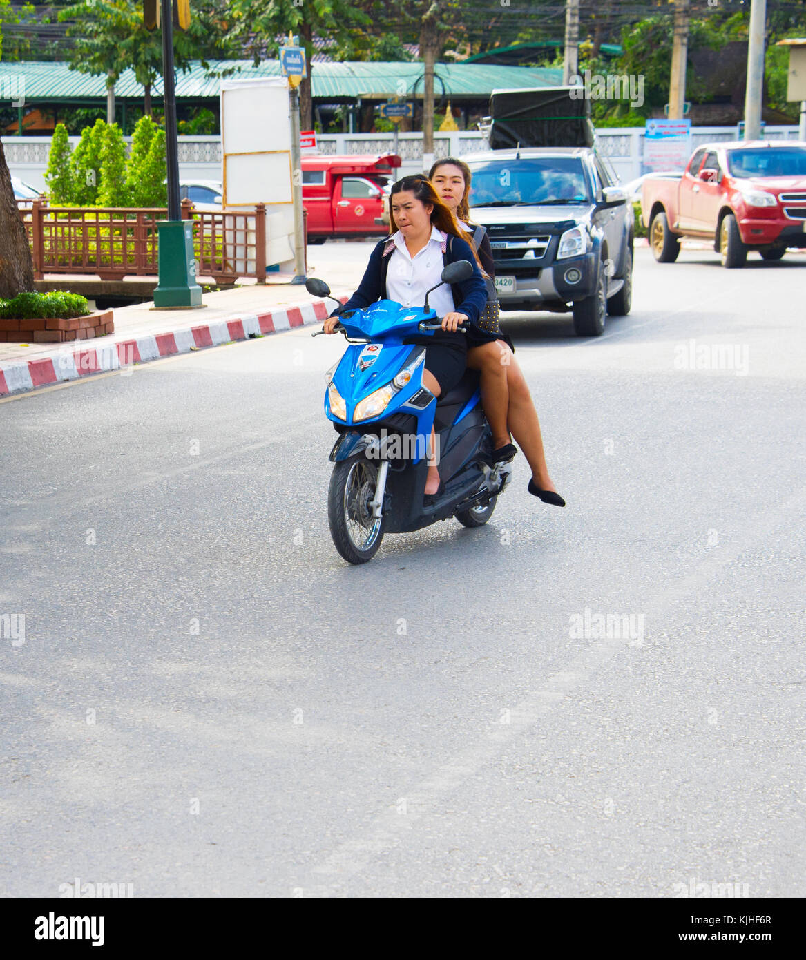 CHIANG MAI, THAILAND - JAN 12, 2017: Traffic on a road in Chiang Mai. Chiang Mai is the second largest city of Thailand Stock Photo