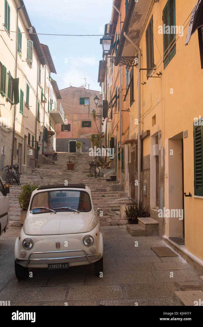 Old Fiat 500 car in a Portoferraio old town alley, Elba island, Italy Stock Photo