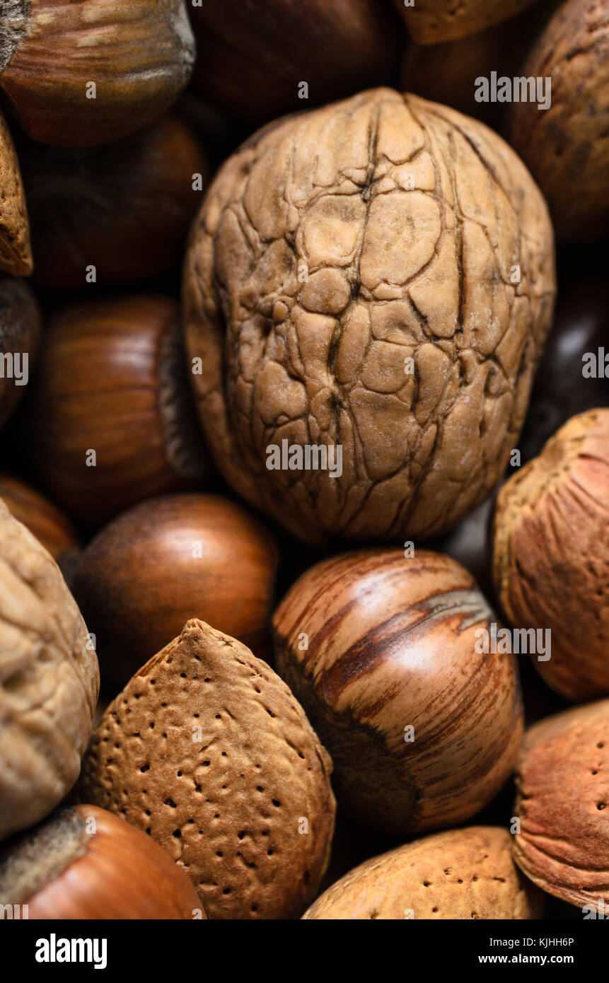Overhead shot of whole, raw and unshelled mixed nuts selection Stock